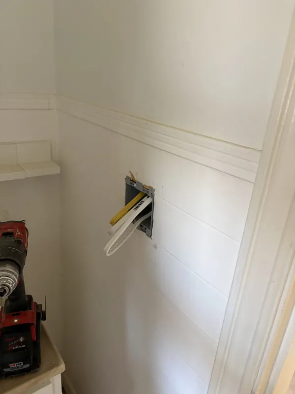 Closet wall after the old equipment was removed
